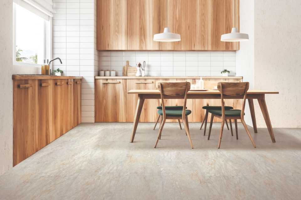 A kitchen with a table and chairs